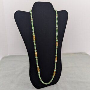 Long vintage bohemian style green glass and gold bead necklace